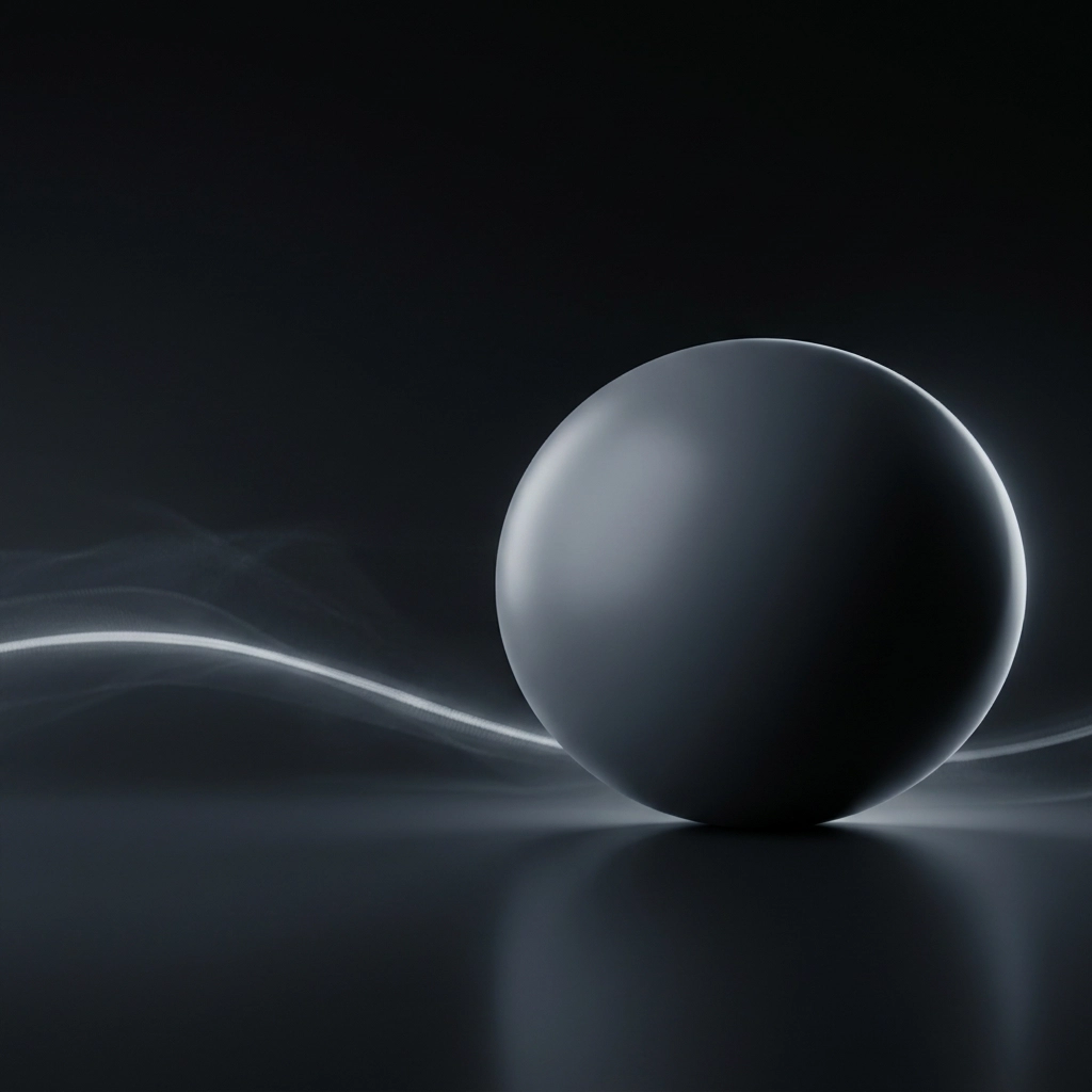 A dark matte sphere catching a thin rim of warm light